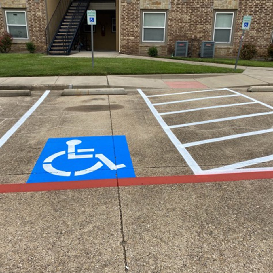 center view of freshly painted fire lanes at Red Oak Apartments