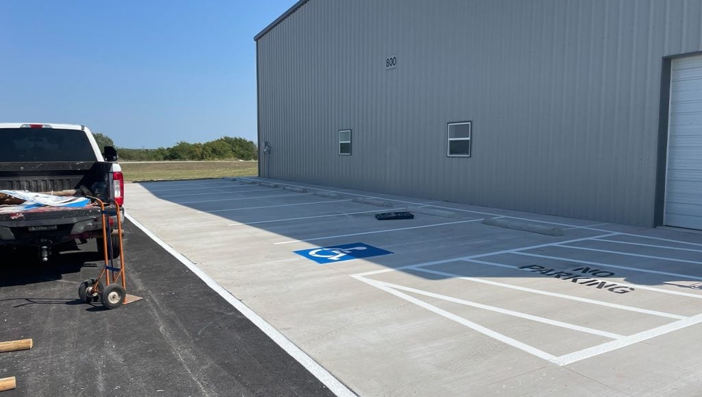 freshly pained parking spots for Decatur Municipal Airport parking lot