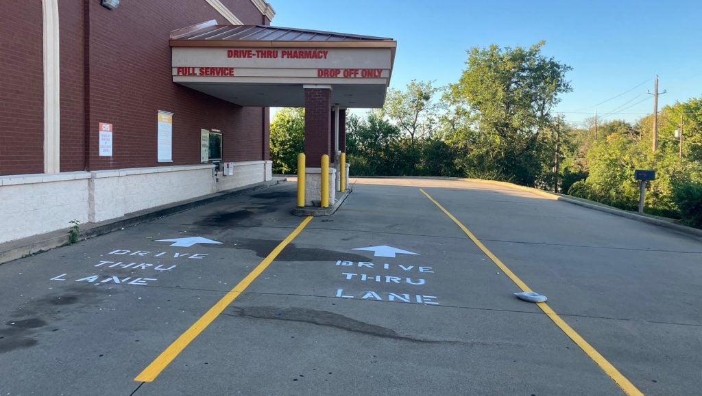 close-up of drive thru markings freshly painted for CVS parking lot