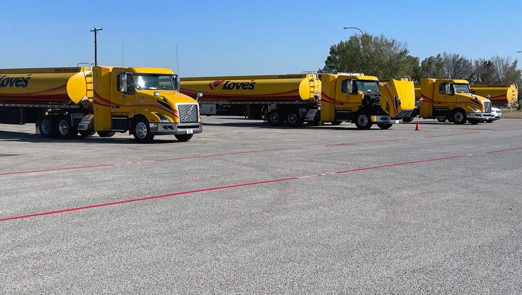 trucks parked in front of fire lane striping at love’s travel stop distribution center