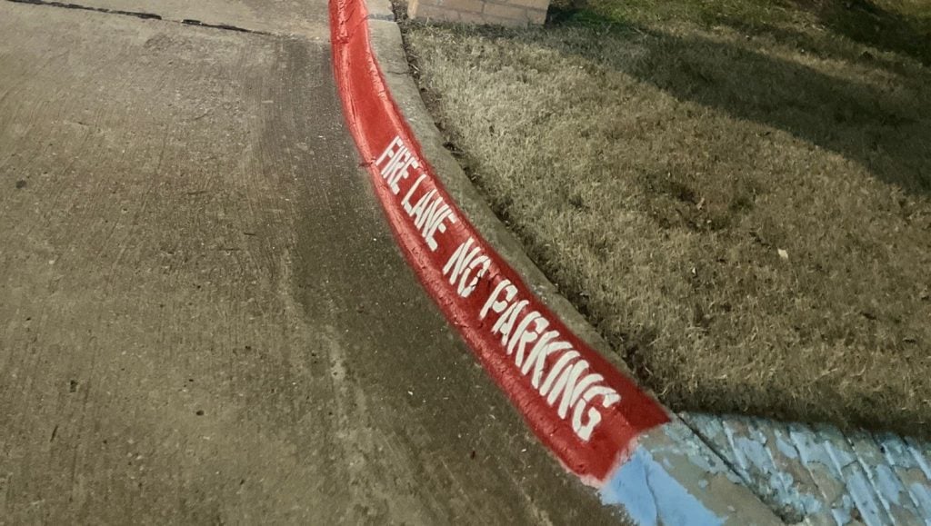 close up of fire lane striping freshly painted