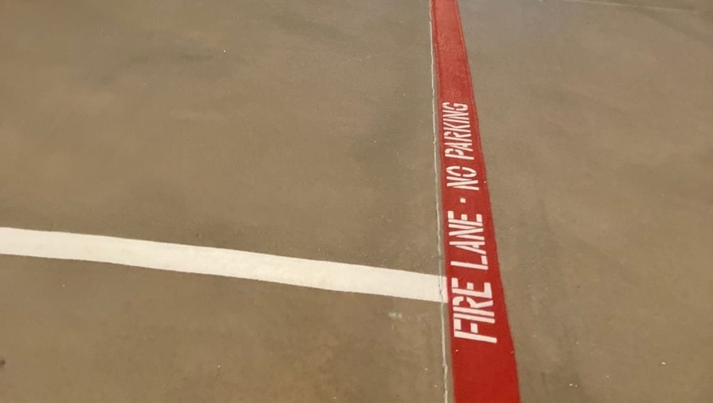 close-up of fire lane striping for Jersey Mike's Subs parking lot