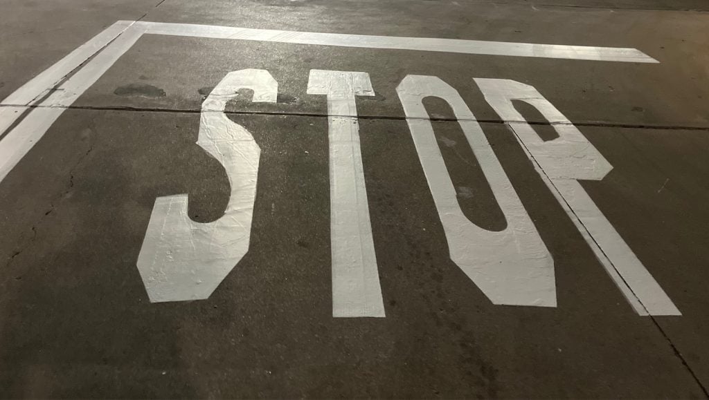 "stop" freshly painted for IN-N-OUT parking lot