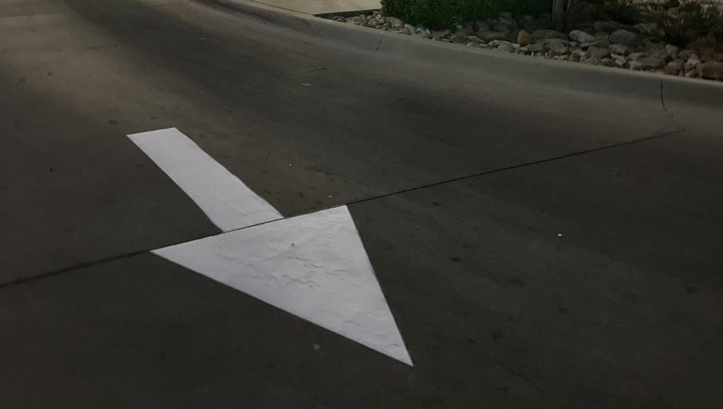 white arrow freshly painted for IN-N-OUT parking lot