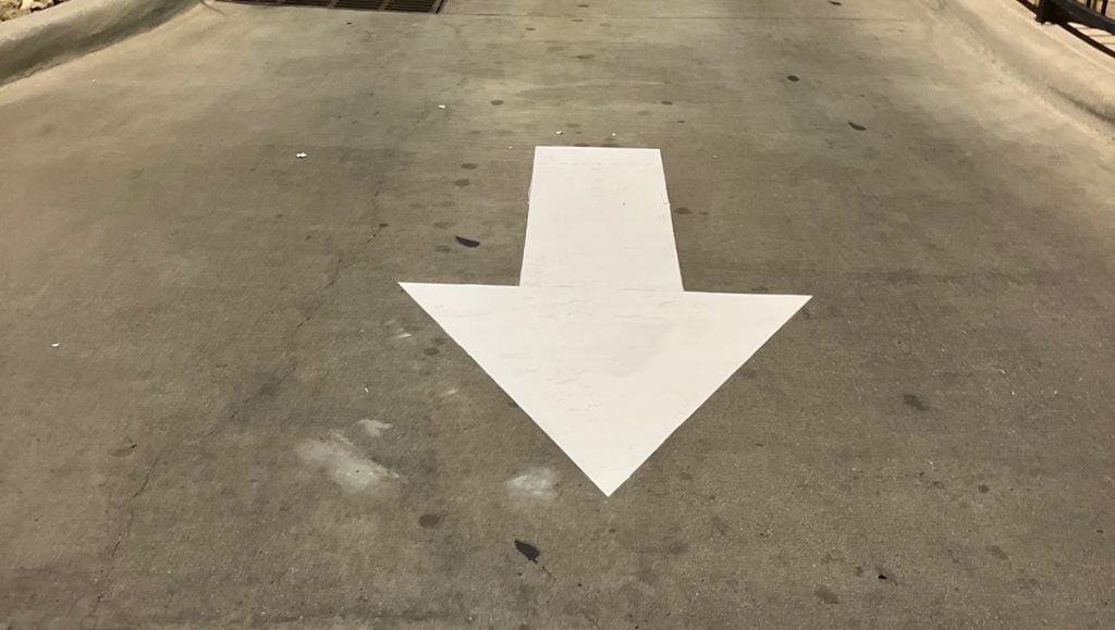 white arrow freshly painted for IN-N-OUT parking lot