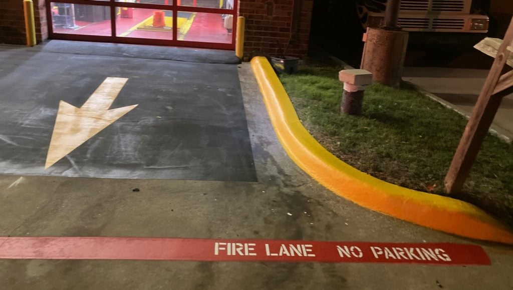 line striping freshly painted for Take 5 Oil Change parking lot
