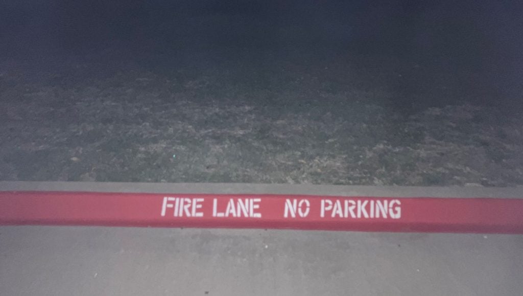 close-up of fire lane striping freshly painted for St. Claire Dental Office