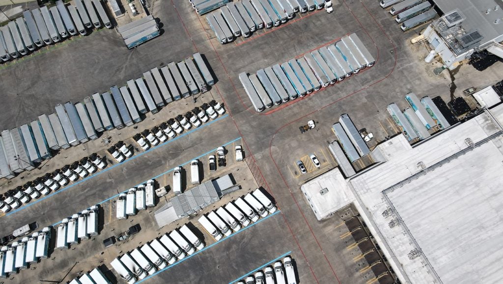 aerial view oak farms parking lot with trucks