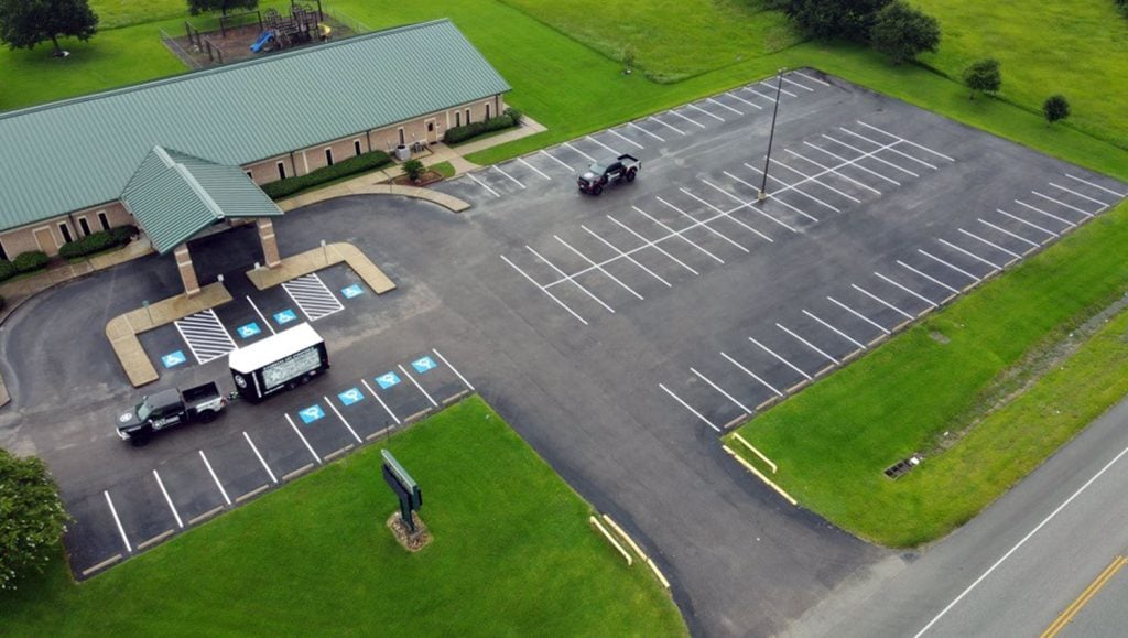 birds eye view of line striping at alvin lutheran church in alvin, tx