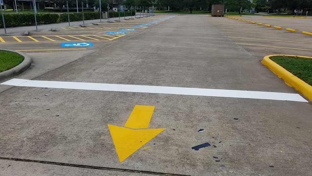 traffic markings in concrete parking lot
