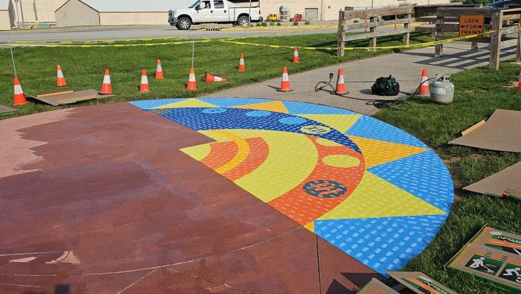 before and after of 20' round Preformed Thermoplastic Sundial