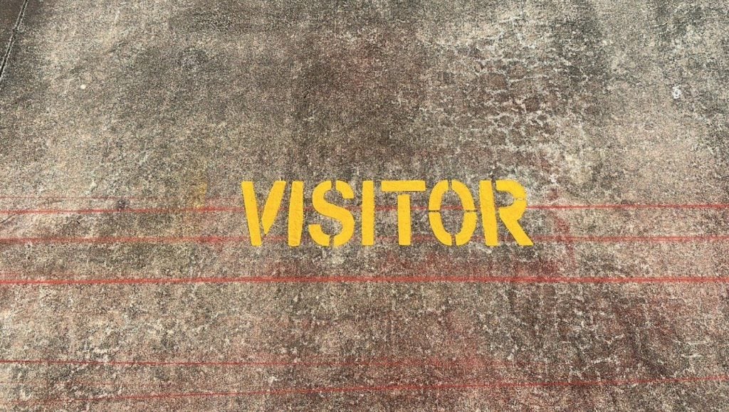 “Visitor” marking on the pavement
