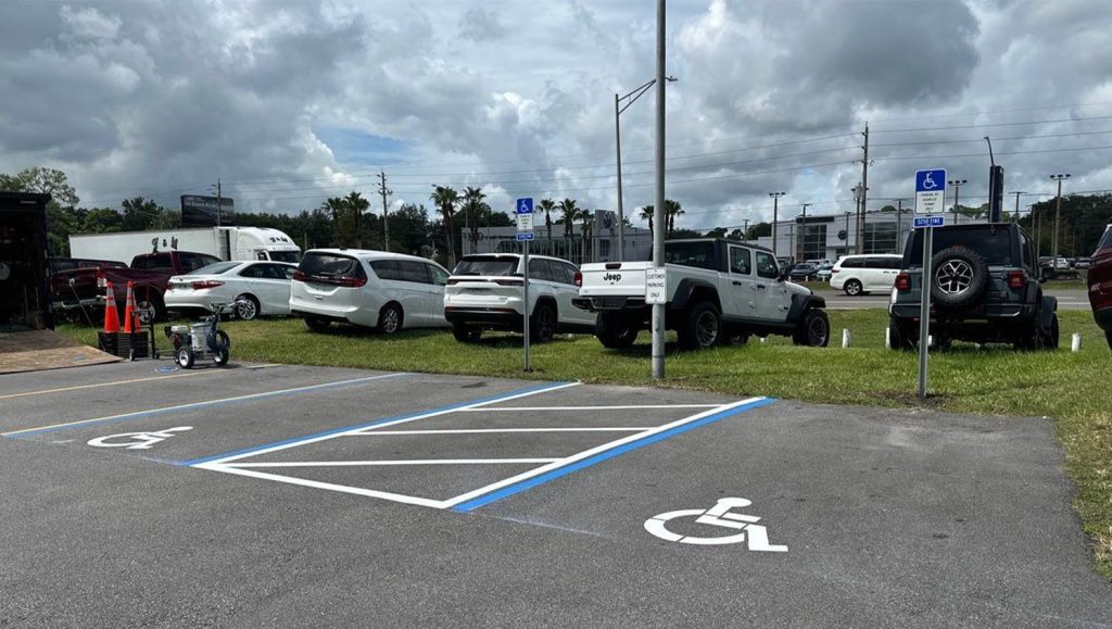ada compliance parking spots freshly painted for DARCARS Dealership