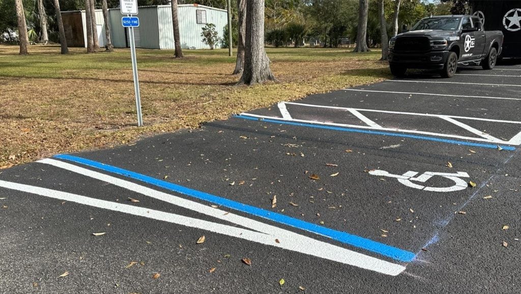 close-up of ada compliance parking spots freshly painted for Dignity Memorial Funeral Home