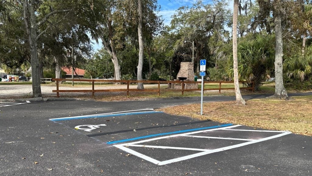 side view of ada compliance parking spots freshly painted for Dignity Memorial Funeral Home