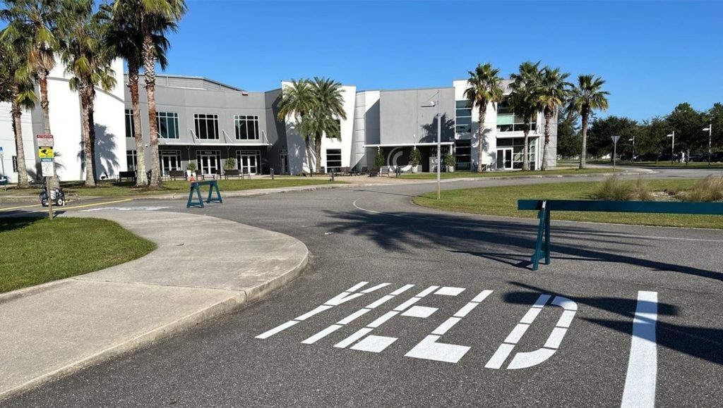 freshly painted white arrows for Celebration Church parking lot