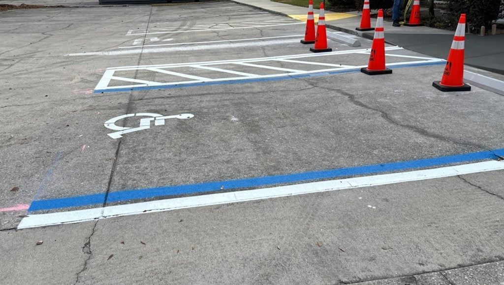 ada compliance parking spots freshly painted for Marand Builders and Brooks RehabilitationMarand Builders and Brooks Rehabilitation parking lot