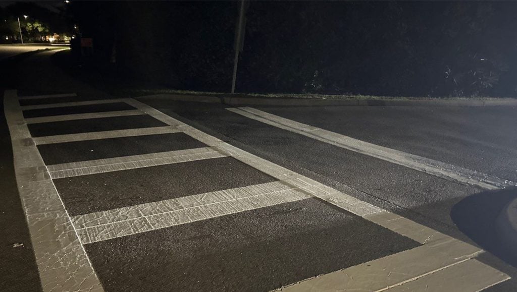 Mister Car Wash parking lot with freshly painted crosswalk close-up