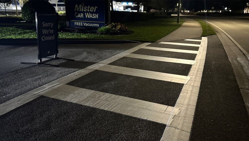 close-up of crosswalk freshly painted for Mister Car Wash