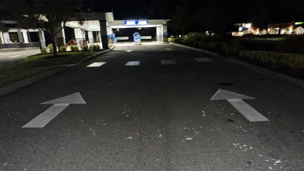 freshly painted white arrows for Mister Car Wash