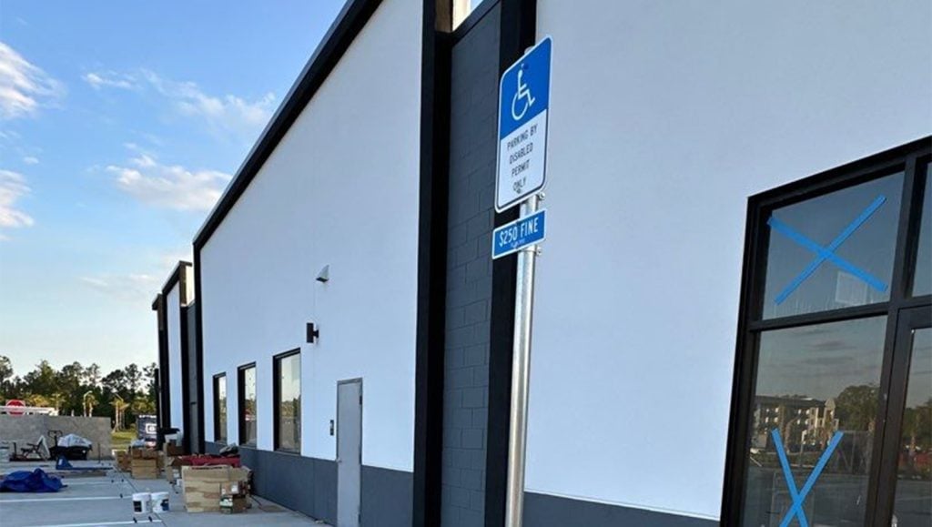 close-up of ada compliance signage at Luv Car Wash
