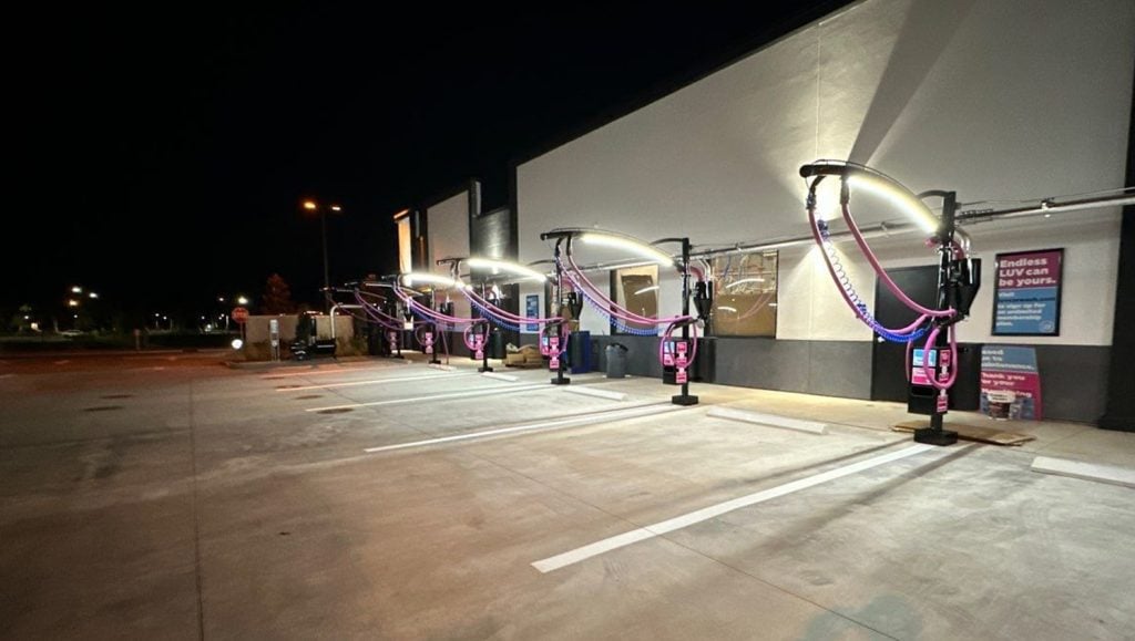 freshly painted white arrows on Luv Car Wash parking lot