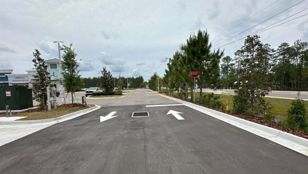 freshly painted white arrows for 7-11 parking lot