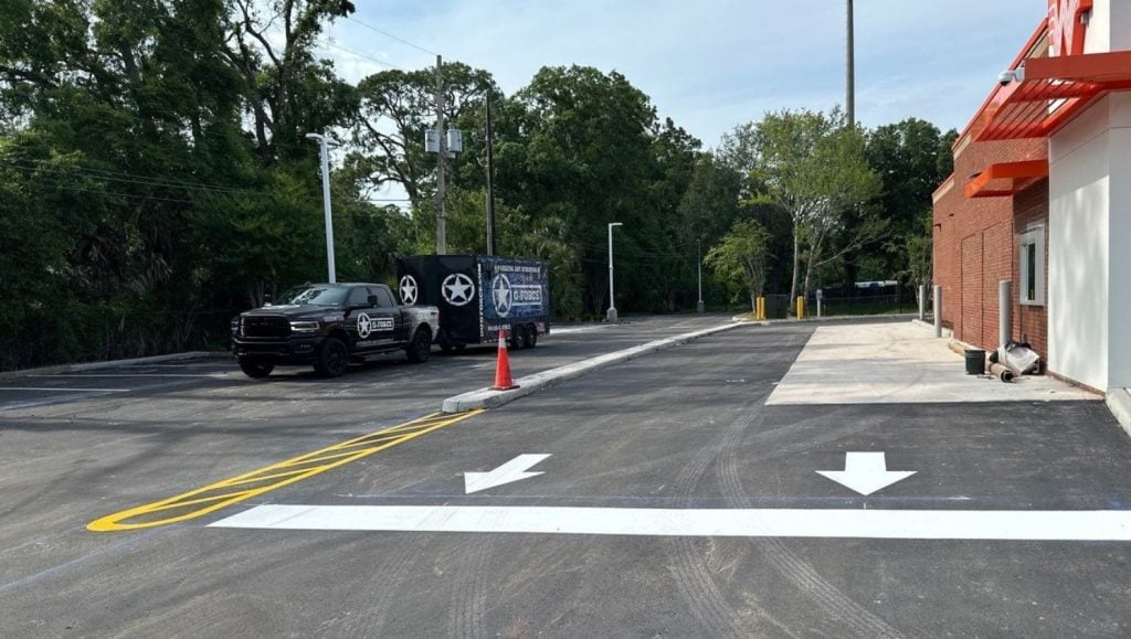 white arrows freshly painted for Whataburger parking lot