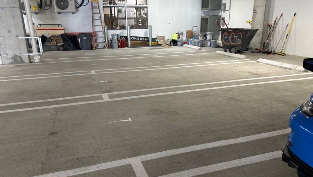 parking garage with new parking stops installed
