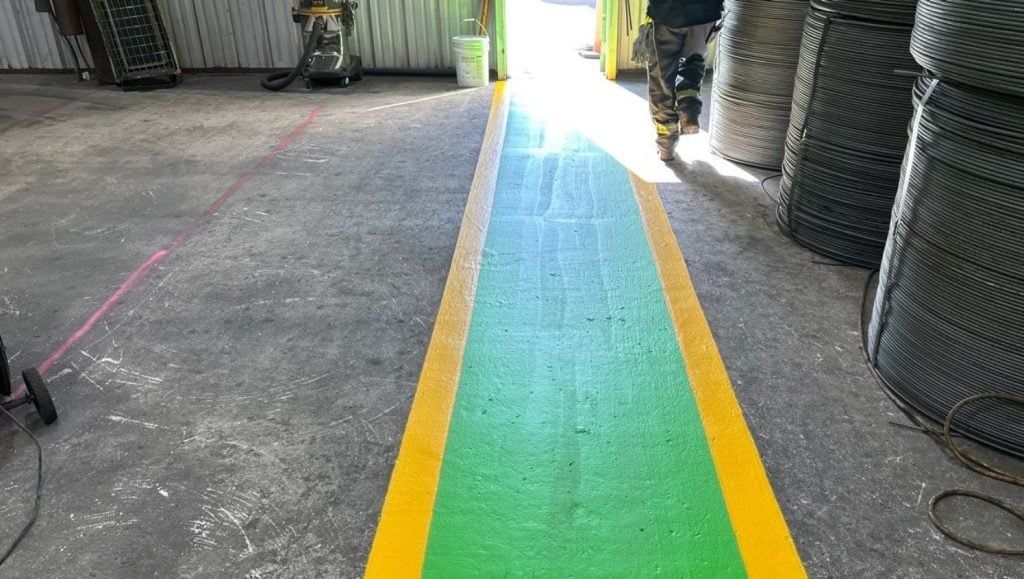 close-up of warehouse floor markings for CMC Steel