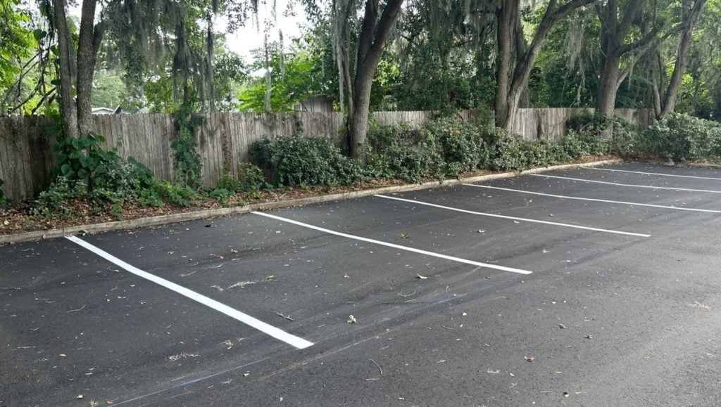 close-up of parking spots freshly painted for Assisting hands parking lot