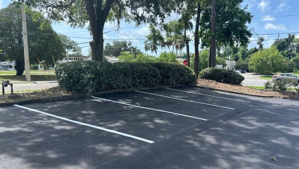 parking spots freshly painted for assisting hands parking lot