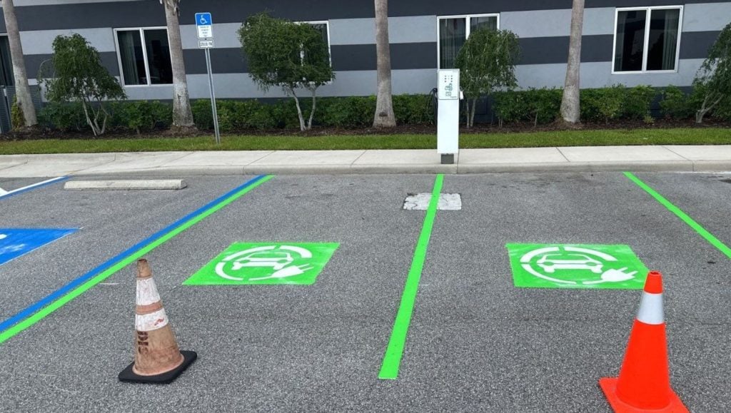 ev charging parking spots freshly painted for Fairfield Inn & Suites Daytona Beach parking lot