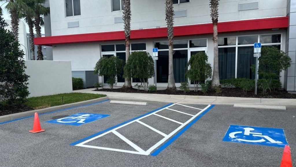 ada compliance parking spots freshly painted for Fairfield Inn & Suites Daytona Beach parking lot