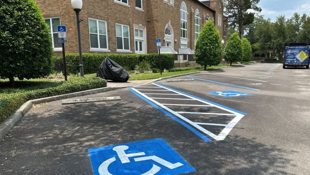 ada compliance parking spots freshly painted for The John Gorrie Condominiums