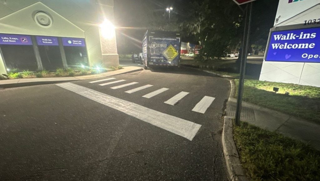 freshly painted line markings for PM Pediatrics parking lot