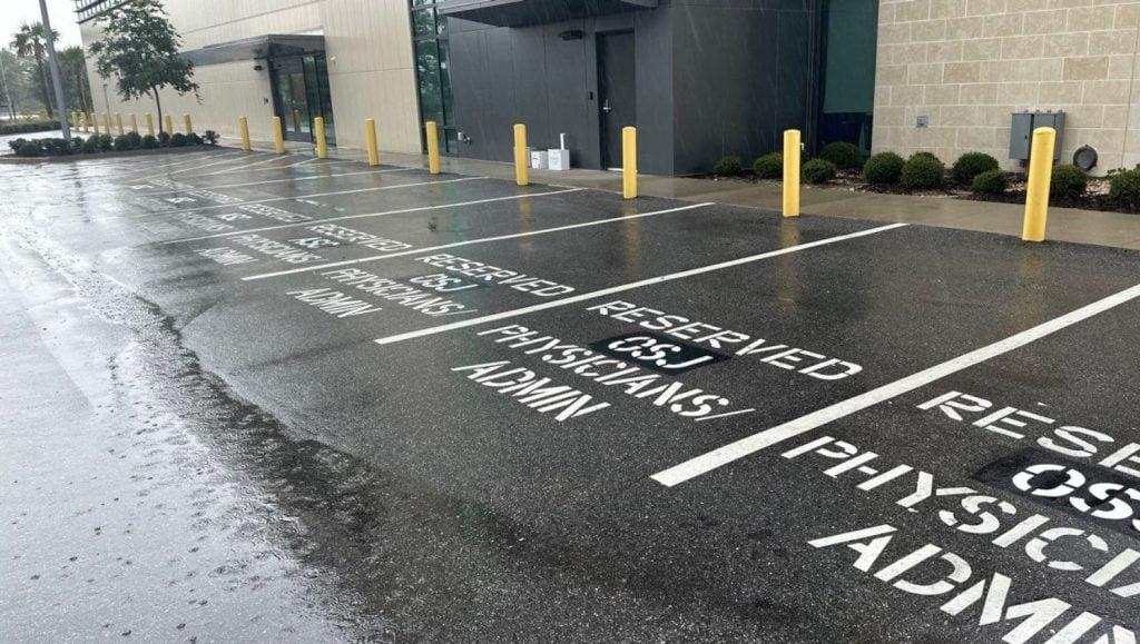 parking spots freshly painted for UF Health East parking lot