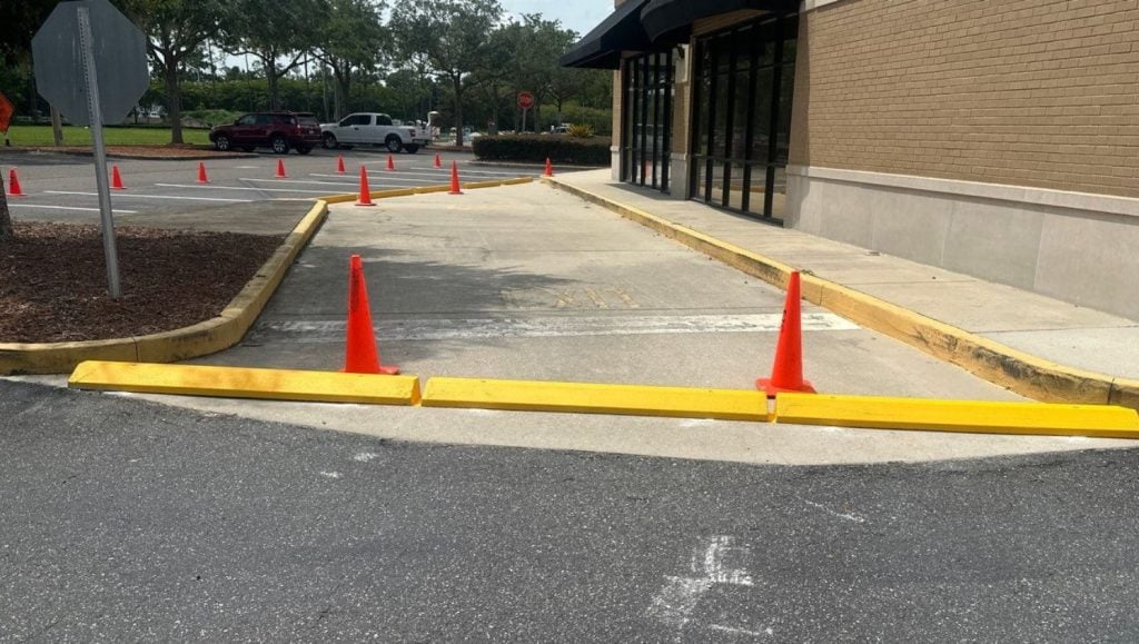 close-up of Flemming Island Village Square Plaza parking lot with parking stops installed