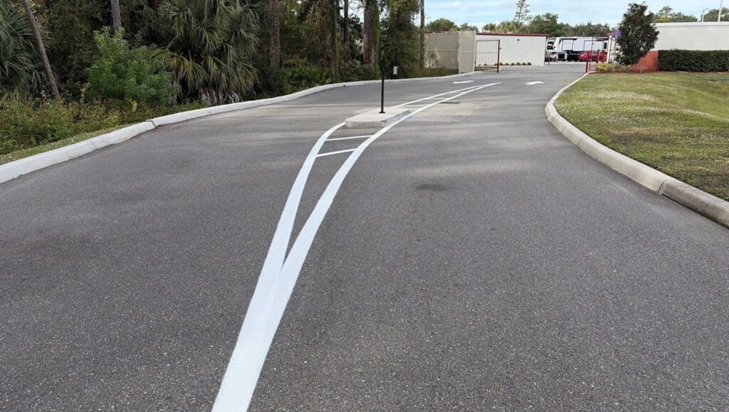 white line striping freshly painted for Acorn Mini Storage