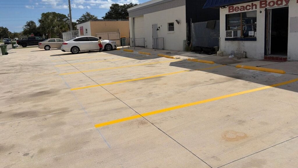 parking spots freshly painted for Beach Body Towing parking lot