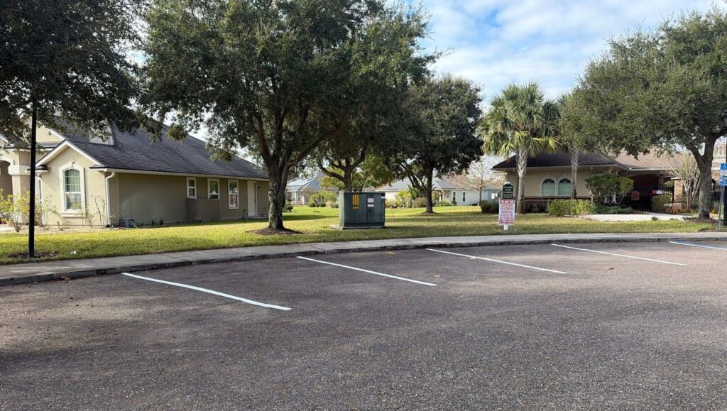 parking spots freshly painted for Governmental Management Services - Amelia Concourse CDD
