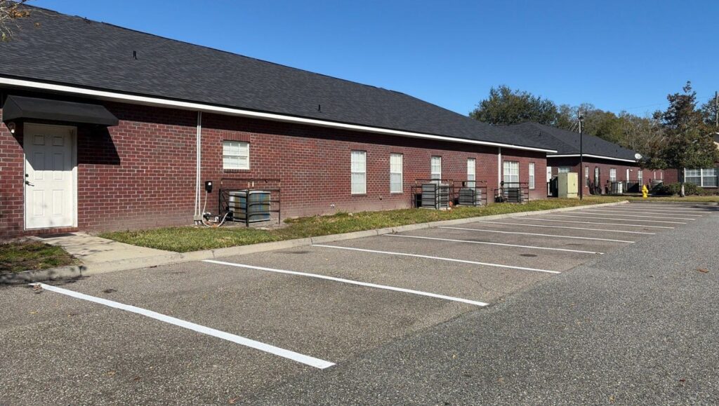 Johnson Property Management parking lot with freshly painted parking spots