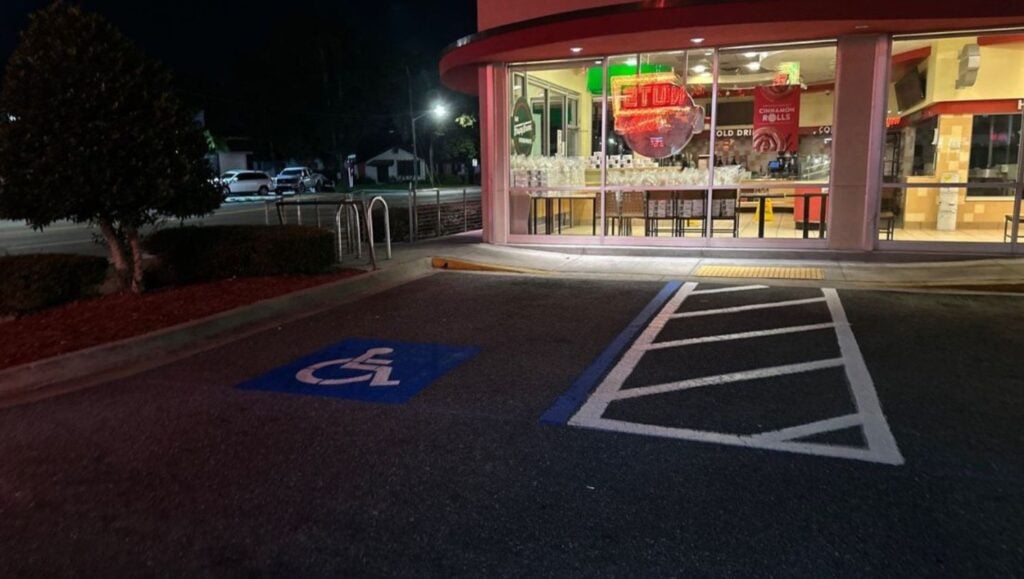 close-up of ada compliance parking spot freshly painted for Facility Maintenance Plus