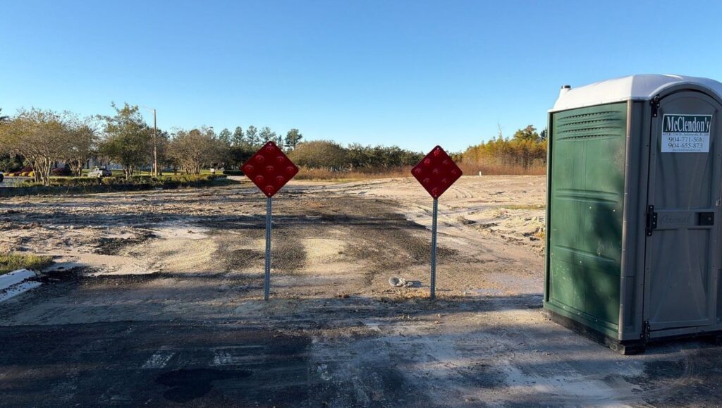 sign installation for Fields Porsche parking lot