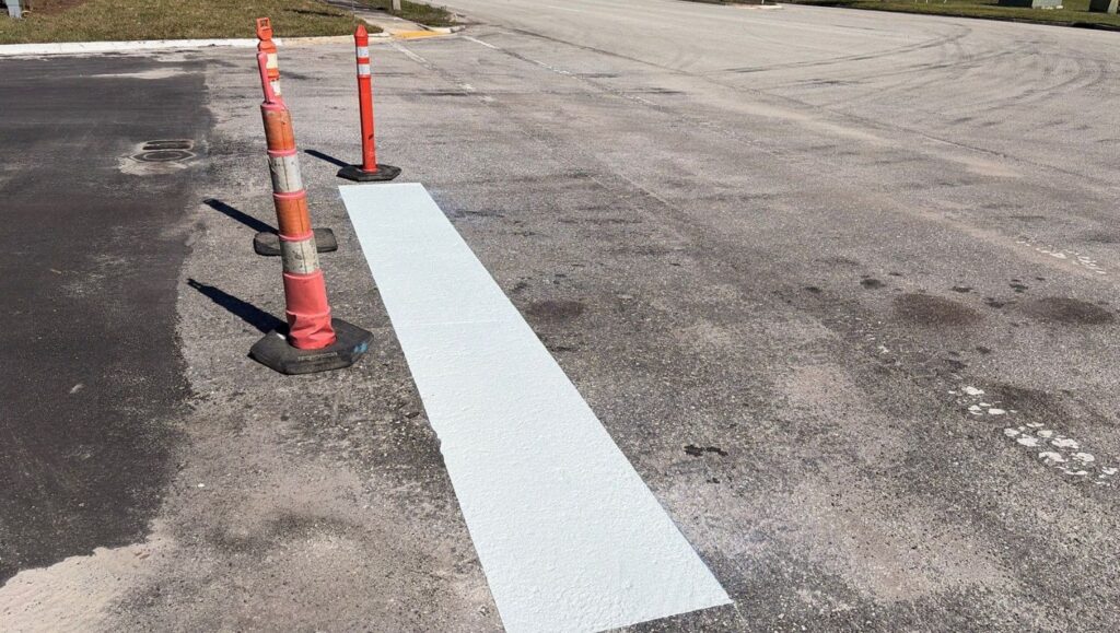white solid line marking freshly painted for Fields Porsche parking lot