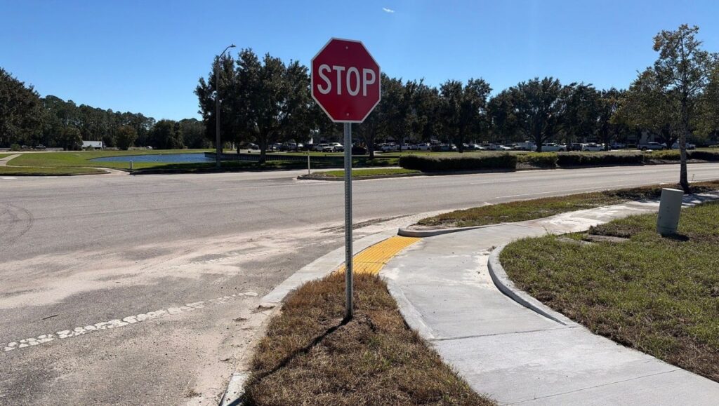 stop sign installed for Fields Porsche parking lot