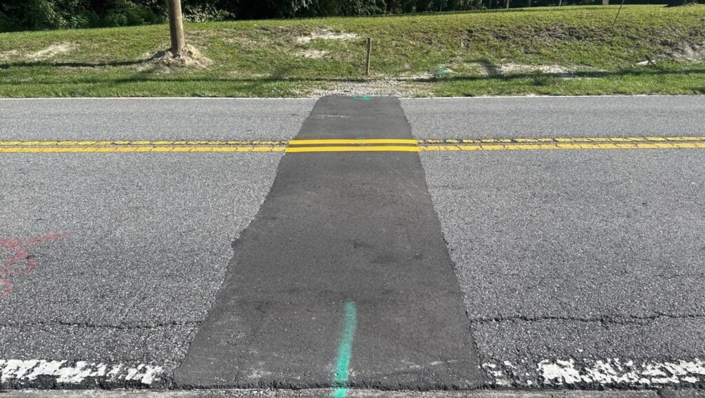 yellow line markings freshly painted for Alterra Group