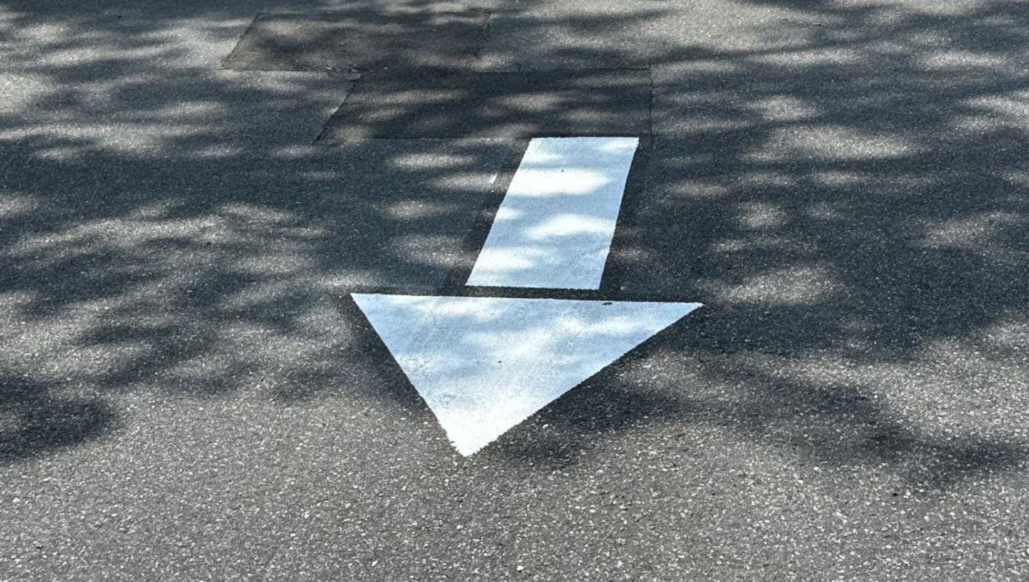 a straight arrow painted on the street