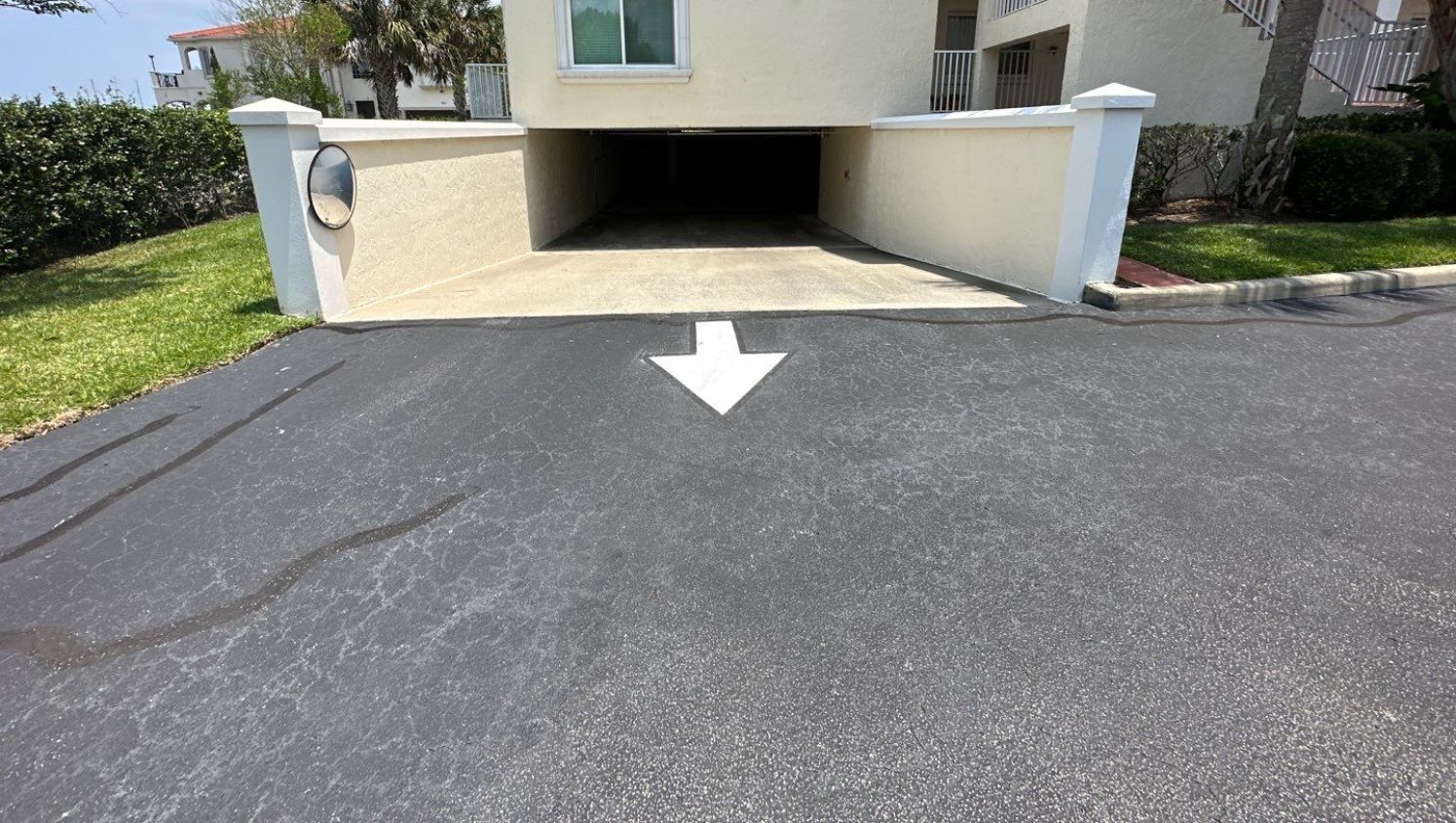 a white arrow pointing out of a garage