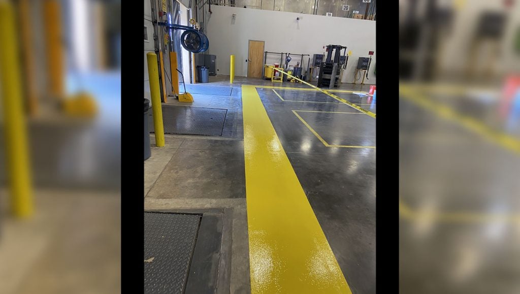 2-foot wide safety yellow border in warehouse